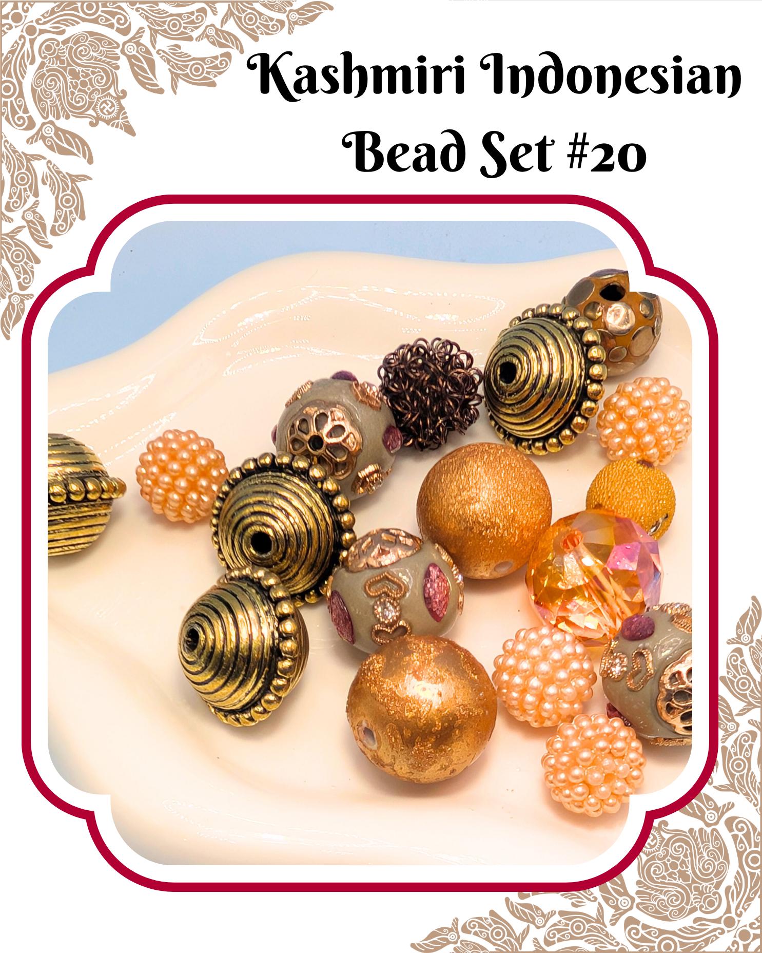 a collection of colorful beads, including gold, silver, and pearl-like beads, arranged on a white surface.