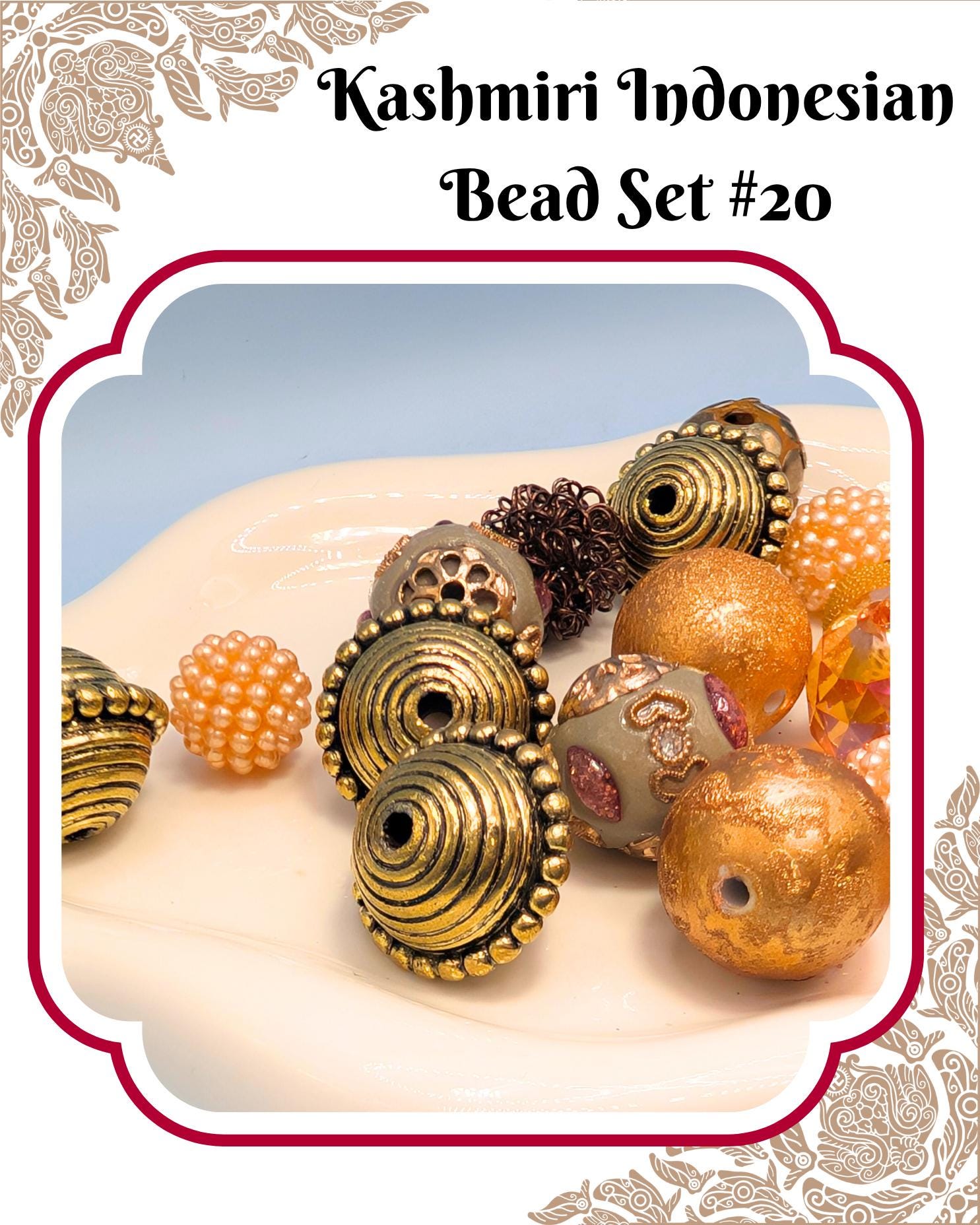 a collection of colorful beads, including gold, orange, and brown beads, arranged on a white surface.