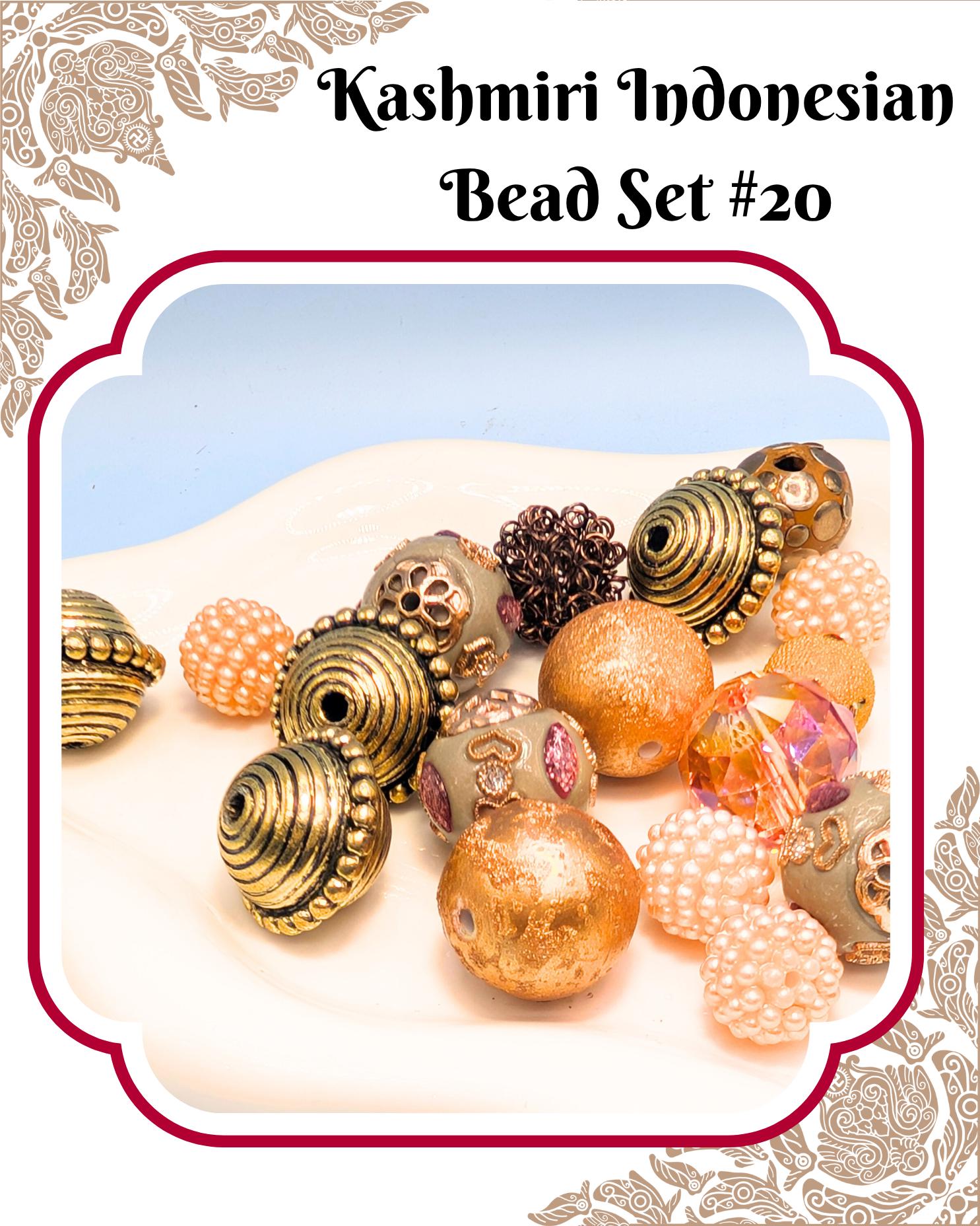a collection of colorful beads, including gold, silver, and pearl-like beads, arranged on a white surface.