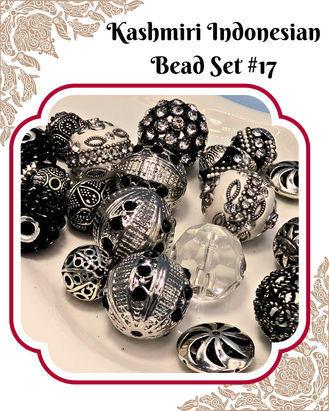 A white plate filled with various decorative beads and charms, including some with intricate designs and sparkling embellishments.