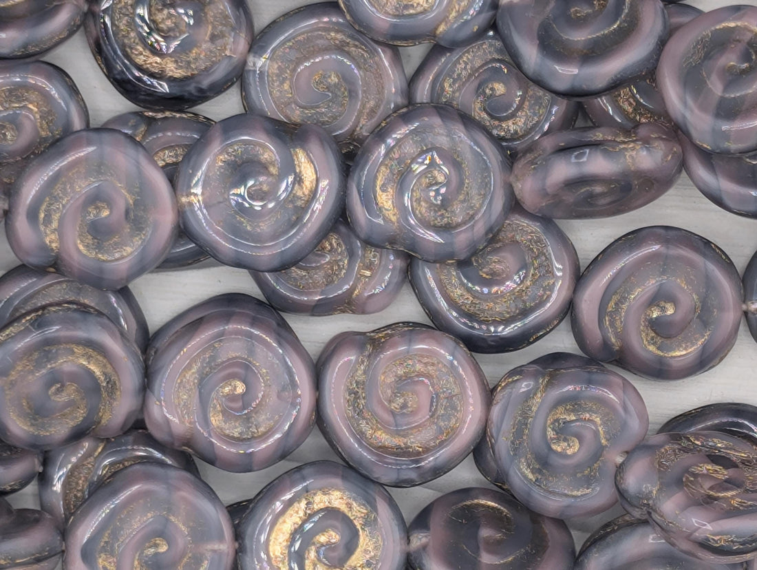 a collection of spiral-shaped objects with a dark purple and gold color scheme, arranged in a grid-like pattern.