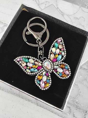 A keychain with a butterfly design, featuring a variety of colorful gemstones and sparkling rhinestones.