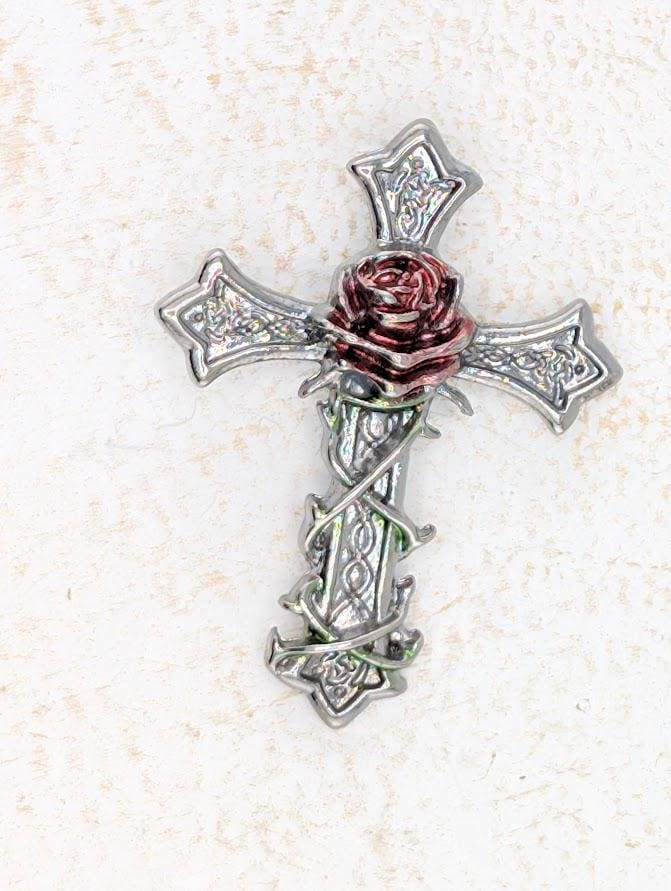 A silver cross with a red rose on top, set against a white background.