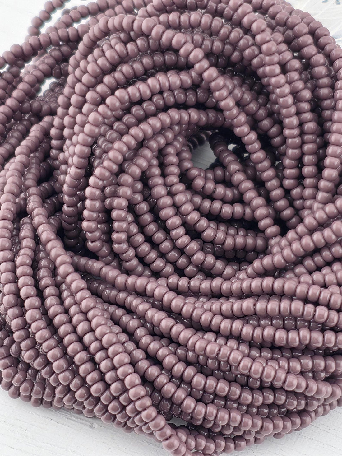 Preciosa 11/0 Czech Purple 6 String/Hnk-Appx 18 Gms