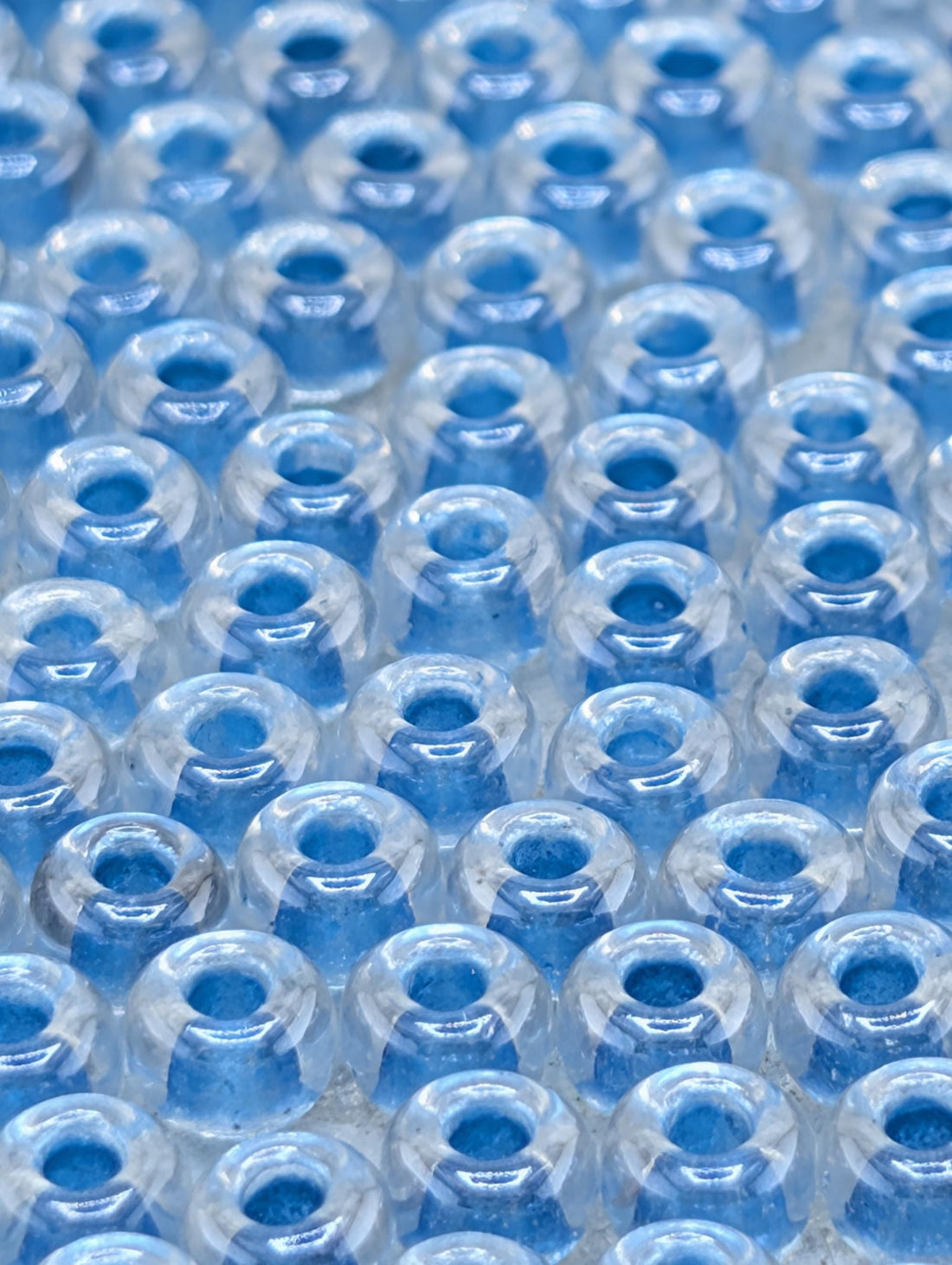 6-1529:Crystal/Med Blue ICL*-Miyuki Rocaille 6/0 (20g pkg ~240 pcs)