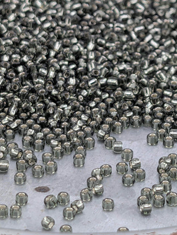 Matsuno Seed Beads: Transparent Gunmetal Silver-Lined - Size 11/0 Round