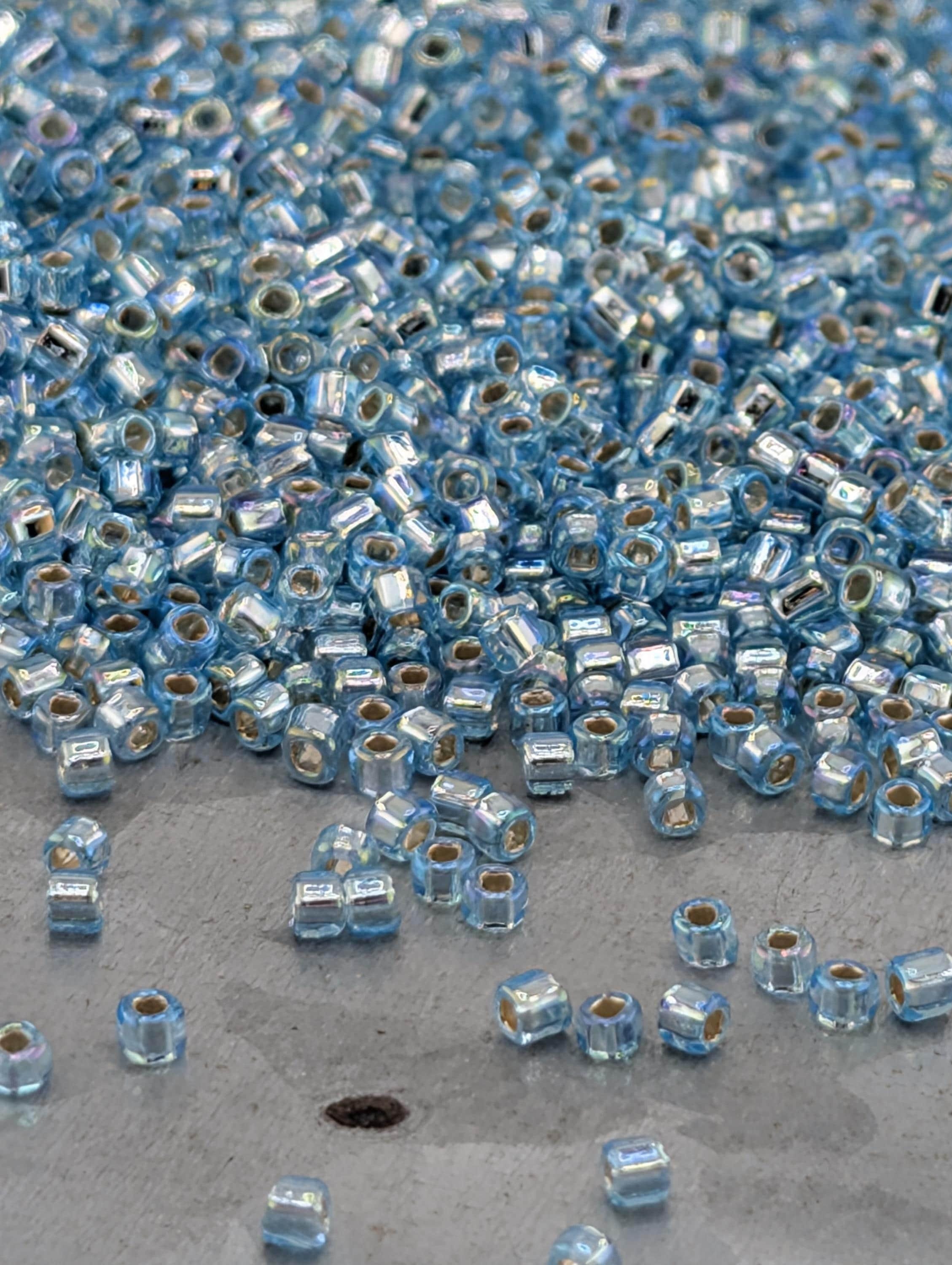 Matsuno Seed Beads: Translucent Silver-Lined Light Aqua - Rainbow Finish