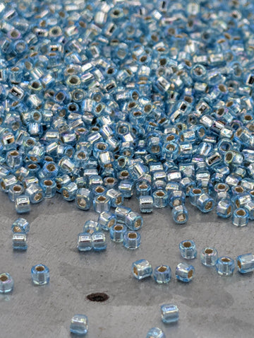 Matsuno Seed Beads: Translucent Silver-Lined Light Aqua - Rainbow Finish