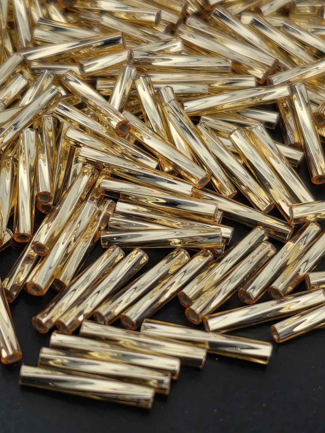 Miyuki Twisted Bugles 2x12 Gold Translucent Silver-Lined Size 2x12mm