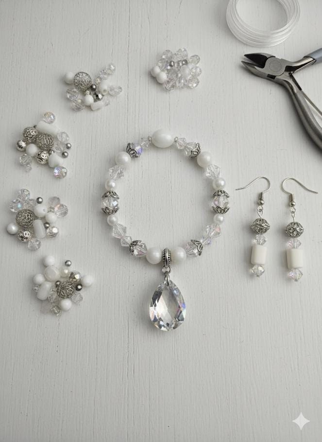 A collection of various clear beads and crystals arranged on a dark surface.