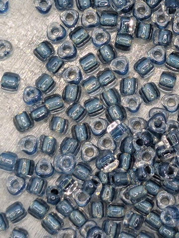 Crystal/Dk Turq Blue Inside Color Lined Sparkle Miyuki Triangle Size 8/0 (15g Pkg)