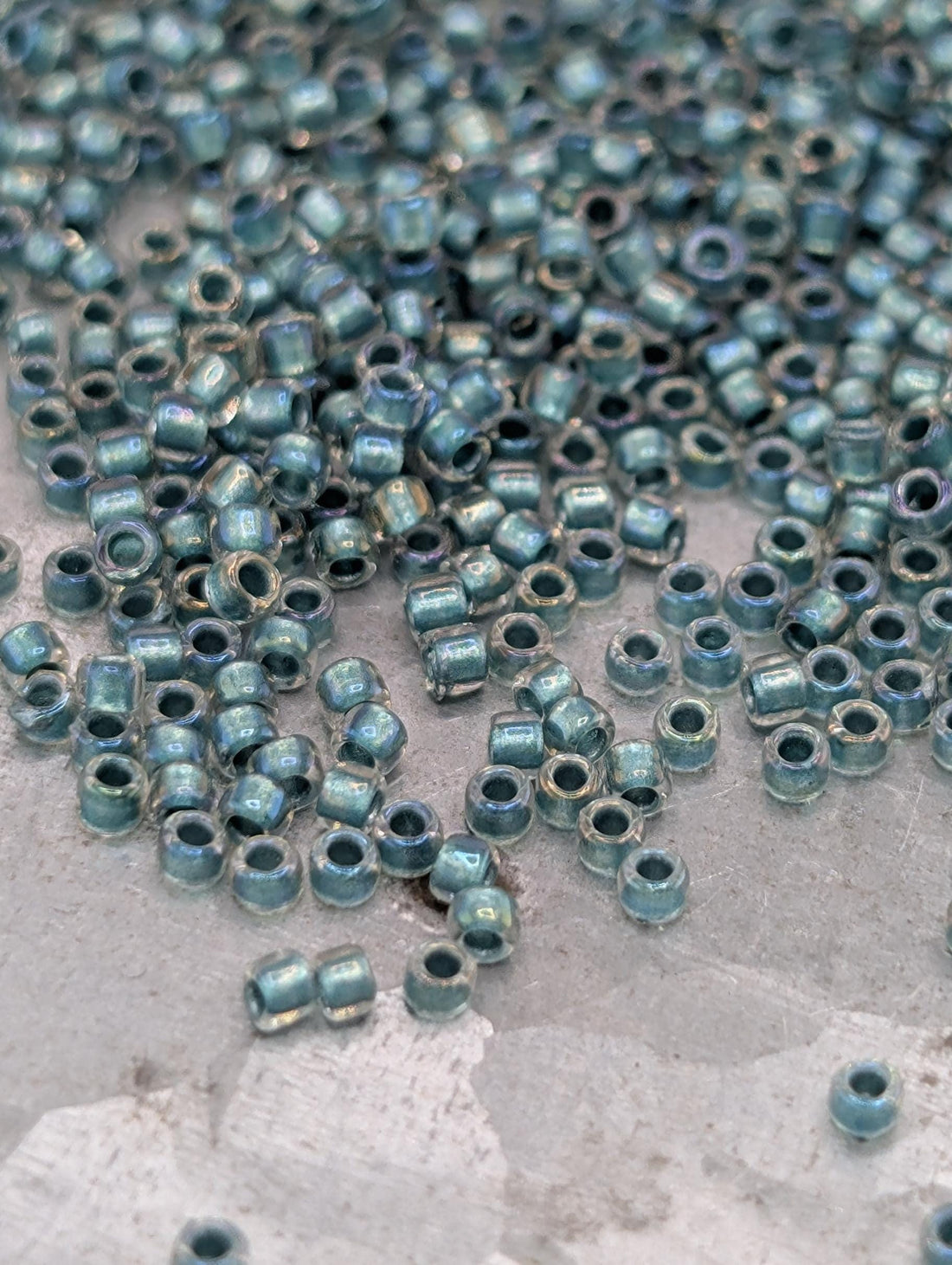 Inside-Color Rainbow Crystal/Teal-Lined Size 15/0 Toho Round 2.5" tube